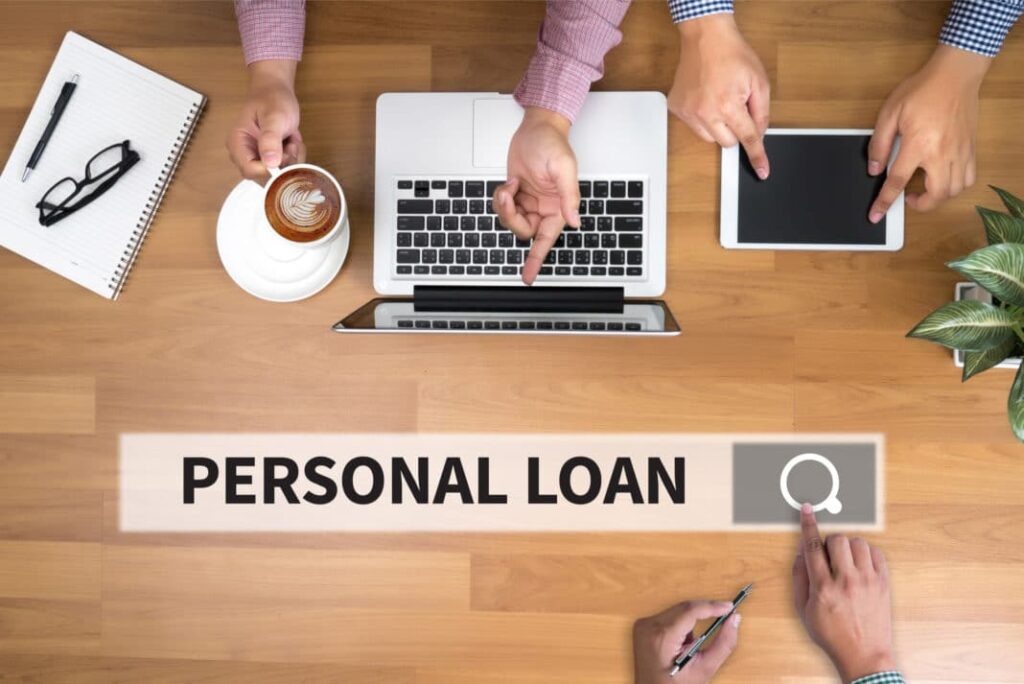 Indian middle-class family comparing personal loans with secured loan options on a digital platform