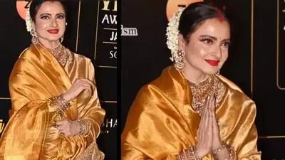 Rekha in a traditional saree, symbolizing resilience and strength after personal loss