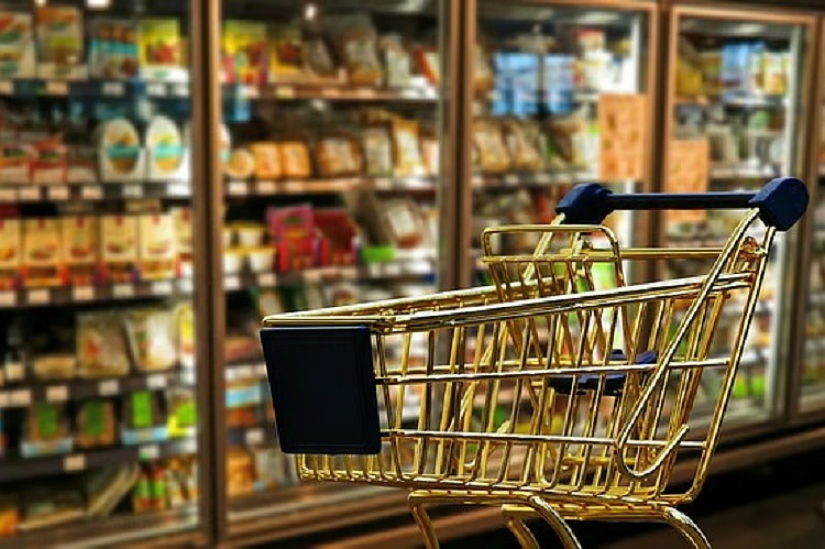 Shopping basket with groceries showing GST price cuts