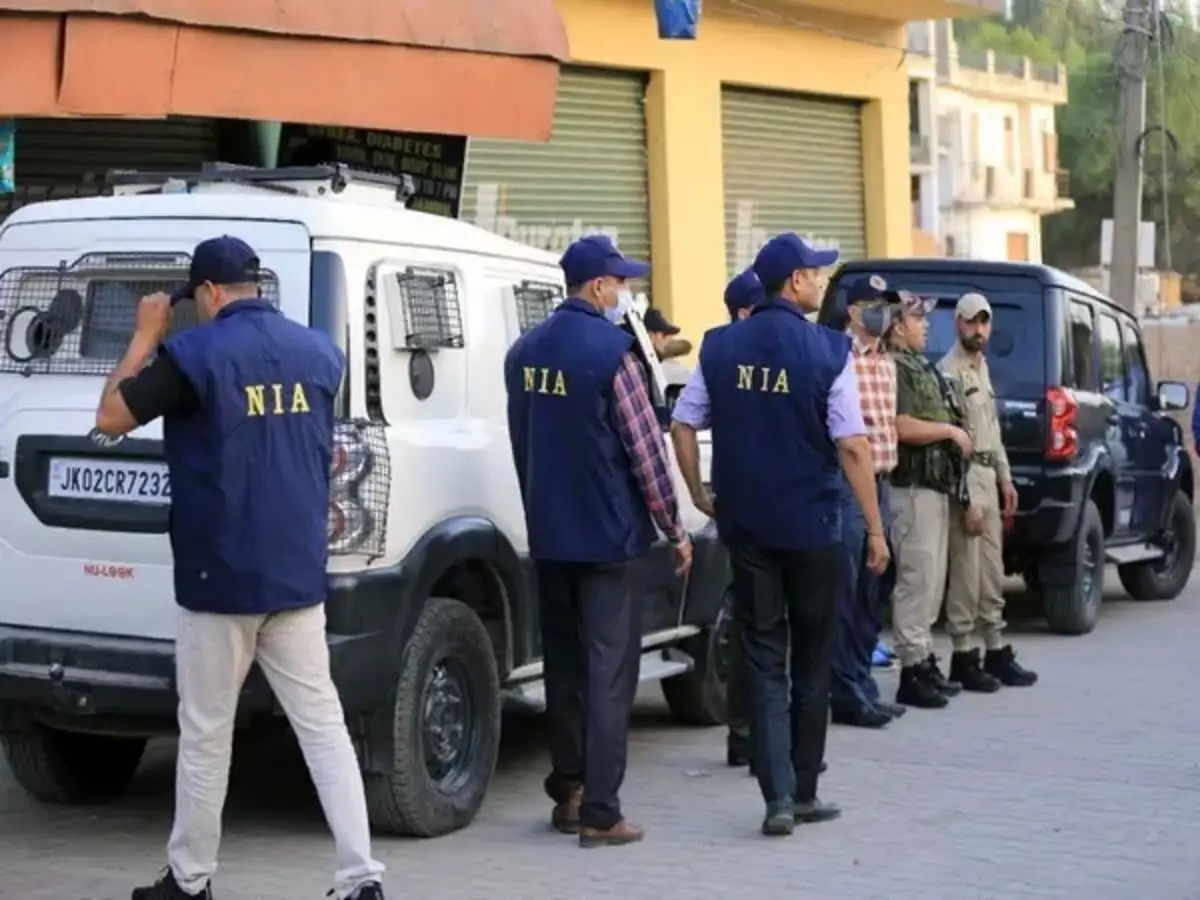 National Investigation Agency team outside a raid location in India