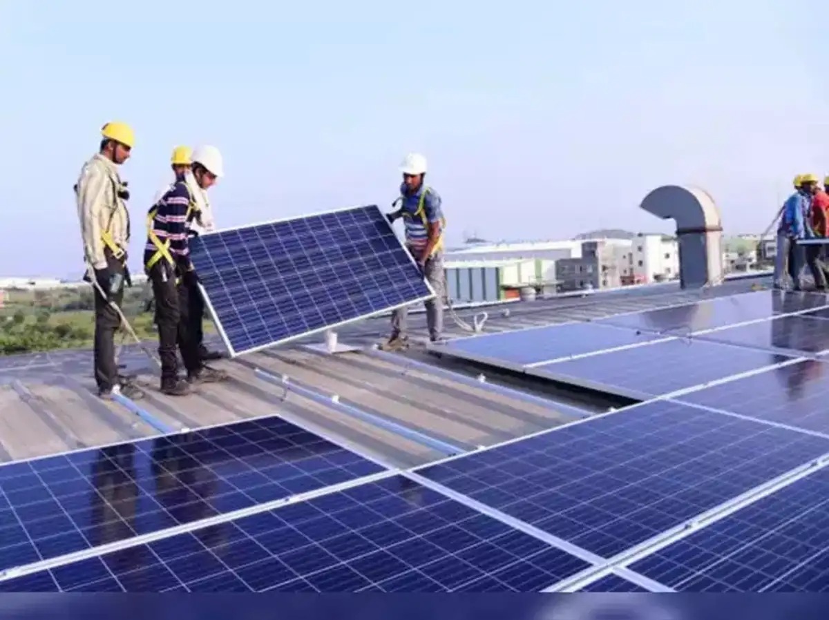 Rural household installing rooftop solar panels using government-subsidised loan