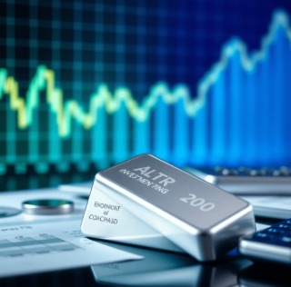 Silver ETF investment concept with coins and charts