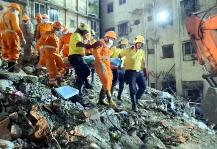 Rescuers evacuating students from collapsed school building in Sidoarjo, East Java