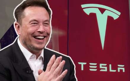 Elon Musk smiling at a Tesla event