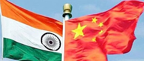 Airplane flying between India and China flags