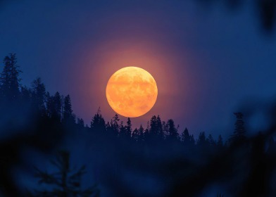 Bright first supermoon of 2025 rising over the horizon in India with clear night sky.