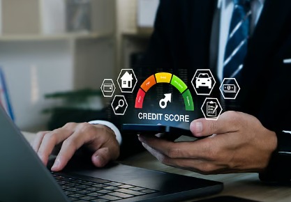 Person managing credit cards and financial documents to maintain a sustainable credit score.