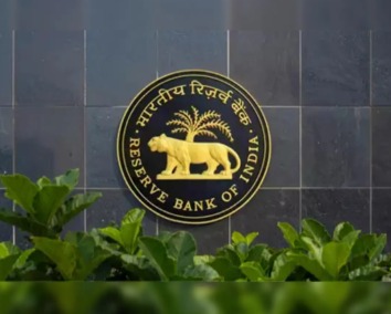 Investor analyzing stock portfolio and RBI’s new ₹1 crore Loan Against Shares policy.