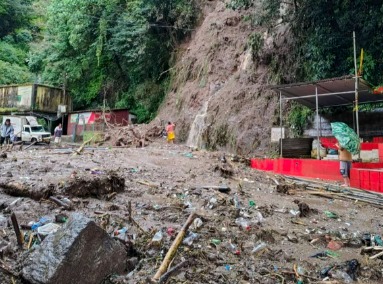 Flooded streets and landslides in Darjeeling after heavy monsoon rains causing school closures and rescue operation