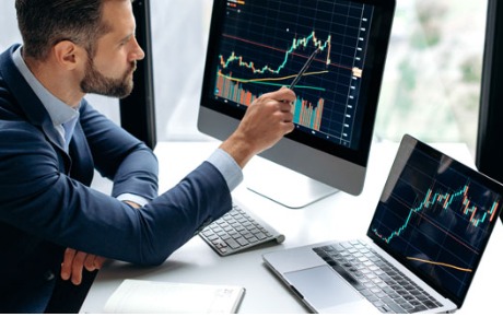Indian stock traders analyzing market data on computer screens