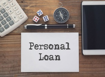 Person calculating EMIs for personal loan on smartphone