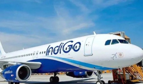 IndiGo airplane on runway with pilot simulator in inset