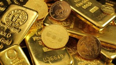 Gold bars and coins representing India’s gold rates on October 9, 2025