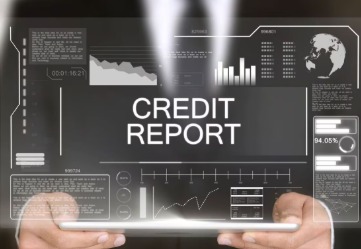 Person reviewing credit report and filing a dispute online