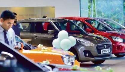 Maruti Suzuki cars on display with festive price banners for buyers taking loans