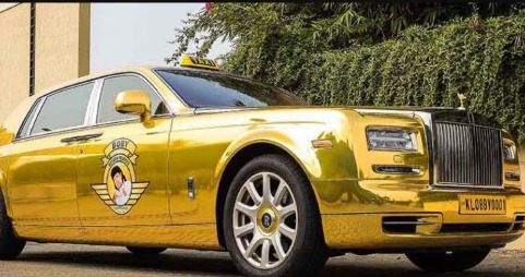 1 kg gold bar with luxury cars Maruti 800, Land Rover, and Rolls Royce in background