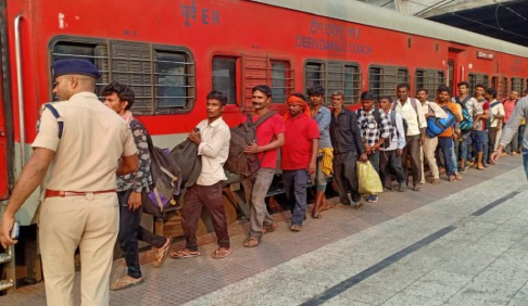 Indian Railways train departing during Diwali festive season with passengers boarding