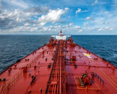 Oil tanker unloading crude oil at an Indian port