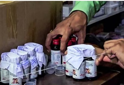 Antibiotic syrup bottle with contamination warning in Madhya Pradesh