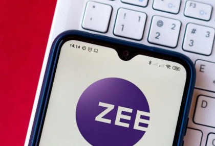 Zee Entertainment logo with stock market graph showing decline, representing media industry trends.