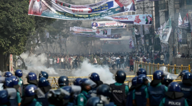 Bangladesh police deploying teargas and sound grenades to disperse protesters near Parliament