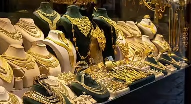 Gold jewelry displayed during Dhanteras 2025 celebrations in India.