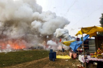 Fire engines battling blaze at Uttar Pradesh firecracker market.