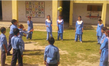 Children playing on a school playground in Uttar Pradesh.