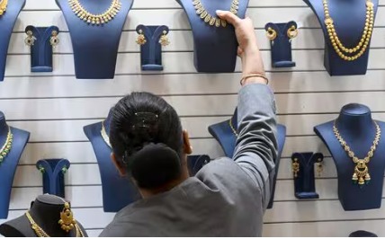 Gold and silver coins and jewelry displayed ahead of Diwali.