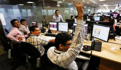 Dalal Street trading floor with traders celebrating Diwali market rally.