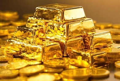 Gold coins and bars stacked for investment purposes.