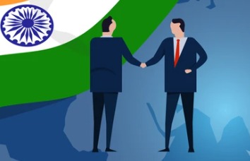 Global investors shaking hands with Indian bank executives.