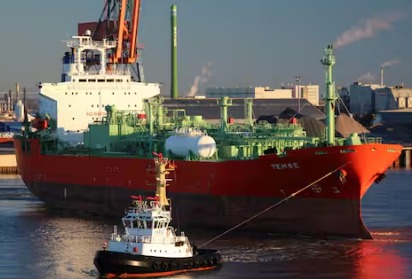 Indian Navy vessel rescuing crew after LPG tanker explosion near Yemen coast.