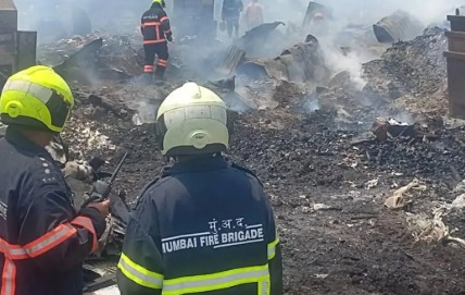 Firefighters battling a blaze at a residential chawl in Mumbai.