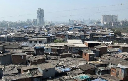 Bhopal slum residents looking at eviction notice during Diwali preparations.