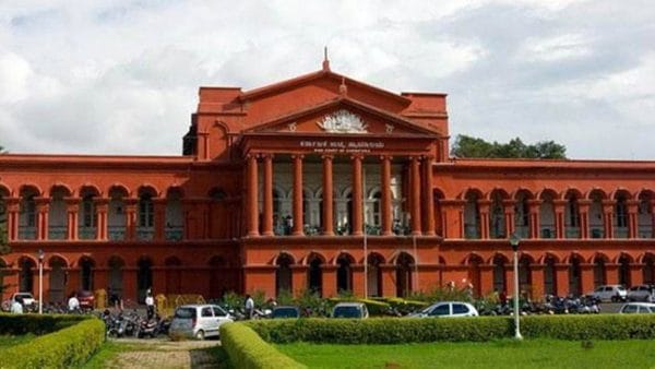 Karnataka High Court building exterior with justice symbol