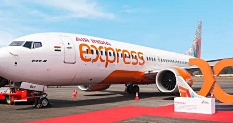 Air India Express plane at Guwahati Airport after returning from Dibrugarh due to technical snag, passengers disembarking safely