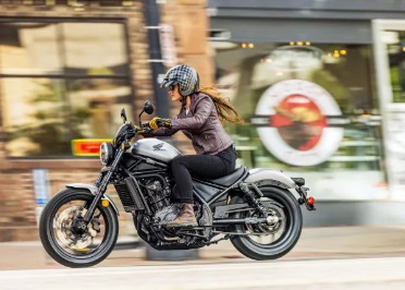 2026 Honda Rebel 300 motorcycle in new color option with E-Clutch technology, parked on city street
