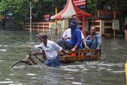 Heavy rainfall in Tamil Nadu with flooded streets and citizens taking safety precautions under red alert