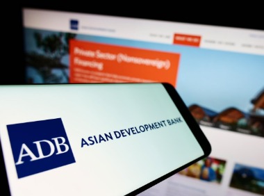 ADB and World Bank officials signing partnership agreement to boost funding for developing nations in 2025