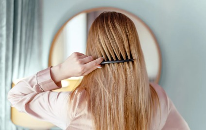 Dermatologist examining patient’s skin and hair to assess health indicators