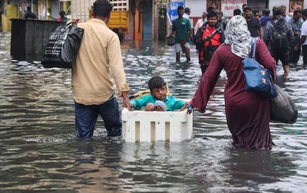 Chennai streets waterlogged during heavy rainfall, schools closed and residents taking precautions