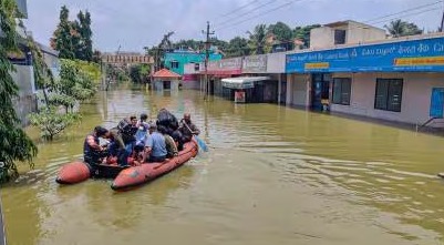 Flooded streets in Bengaluru affecting residential and commercial areas.