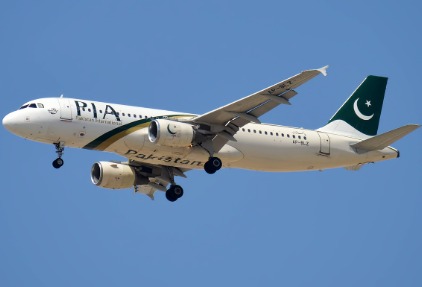 Pakistan International Airlines plane taking off from Karachi Airport.