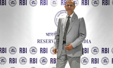 Reserve Bank of India building with financial charts representing lending policy changes