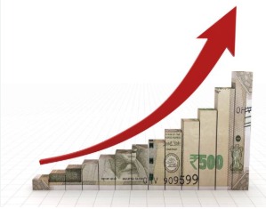 Stack of Indian rupee notes and upward pointing graph showing investment growth