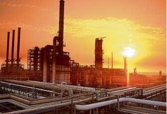 Oil refinery at sunset with rising profit graph showing surge in refining margins
