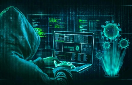 Concept image showing hacker typing on laptop during a large-scale data breach.