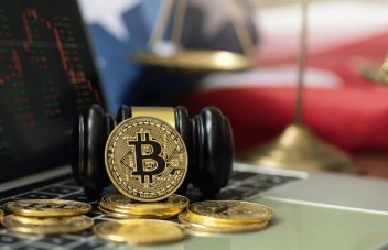 Judge’s gavel and Bitcoin placed on a legal document representing crypto ruling in India