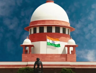 Supreme Court of India building in New Delhi under clear sky.